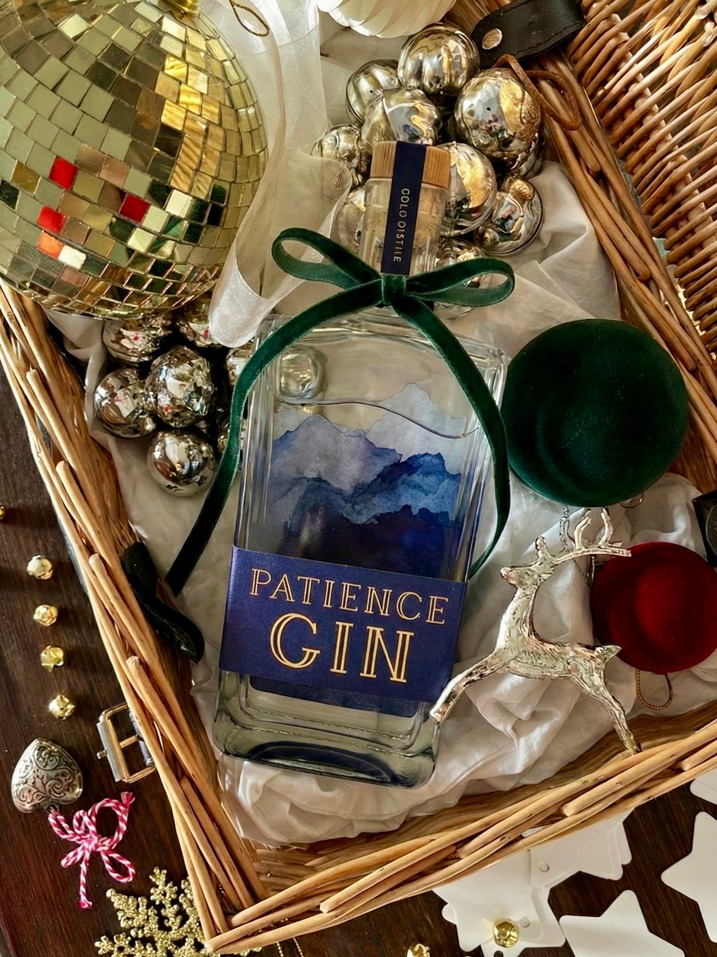 Bottle of Patience Winter Gin with decorative elements in a festive setting